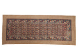 Antique Serab runner with an allover lattice design in red and blue, framed by a wide camel hair border.