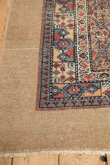 Detail of the wide, plain camel hair border alongside geometric inner borders on an antique Serab runner.