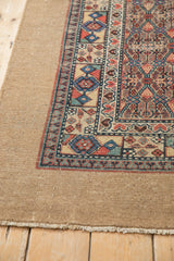 The wide, plain camel hair border and intact side selvage of an antique Persian Serab rug.