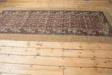 High-angle view of the full antique Serab runner, displaying its traditional lattice pattern.