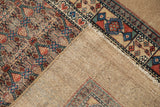 Reverse view of an antique Serab runner showing its hand-knotted camel hair foundation and weave.
