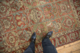 The inscribed medallion and panelled design of a distressed vintage Persian Baktiari rug.
