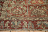 Hand-knotted pile with mostly even wear across the floral panels of a Baktiari rug.