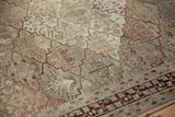Exposed knot heads and worn pile on a distressed vintage Baktiari rug with a lattice pattern.