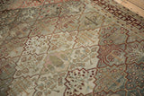 Detailed view of a Baktiari rug's worn pile, showing tree of life motifs in lattice panels.