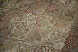 The distressed, hand-knotted pile and visible knot heads of the Baktiari's trellis lattice pattern.
