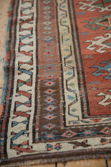 Layered borders of an antique Caucasian rug showing crab style and diamond relief motifs.