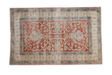 Distressed vintage Caucasian rug, cherry red field, central turtle medallion, faded blue-green patterns. 3'3