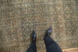 Distressed Bijar rug with heavy abrashes, Herati motif, and Turtle Samovar border in dusty blues and beige.