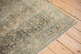 Faded Herati and Turtle Samovar motifs with heavy abrashes on this distressed vintage Bijar rug corner.