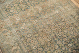 Distressed pile showing Herati design motif in dusty sky blue and beige tones.