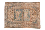 Vintage distressed Qashqai rug with pictorial lion design, faded blue and warm brown.