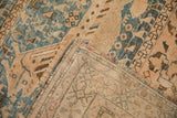 Distressed vintage Qashqai rug corner showing its hand-knotted foundation and intact selvage.