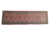 Vintage distressed Malayer rug runner with dusty fuchsia diamond medallions and a Serbend border.