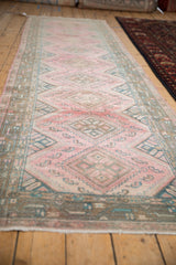 Distressed Malayer runner's Serbend border and mahimahi motifs in dusty fuchsia, teal.