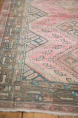 Vintage Malayer runner's worn pile, dusty pink, teal, brown patterns, and Serbend border detail.