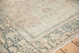 Angled view of the Karaja rug corner, showing the geometric border and softly worn, hand-knotted pile.