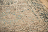 Low hand-knotted pile of a distressed Persian Karaja showing mostly even wear.