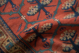 Low pile texture showing blossomed flowers and vines on an antique Northwest Persian runner.