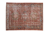 Distressed Persian Karaja rug with a triple medallion design in faded cherry red and sapphire blue.