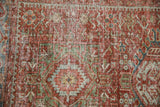 Close view of the worn pile showing pawn elements and knot heads on a distressed Karaja rug.