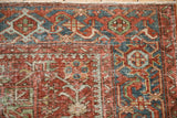 Geometric Samovar border and worn, hand-knotted pile on a vintage Karaja rug corner.
