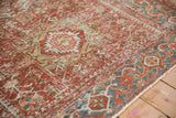 Distressed wear on the cherry red field and blue Samovar border of a vintage Karaja rug.