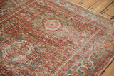 Close-up showing the distressed texture and low pile on a vintage Karaja rug.