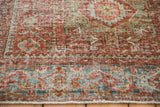 Close-up view of the even wear and visible knot heads of a distressed vintage Persian Karaja rug.