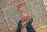 A top-down perspective showing the scale and even wear of a distressed Turkish Oushak rug.