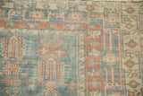 Close view of the vintage Oushak rug's mostly even wear, highlighting its geometric patterns.