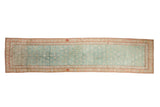 Distressed Karabagh runner, pale turquoise field with plant motifs and dusty red serpent border.