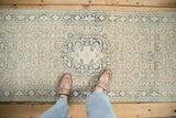Distressed vintage Sparta runner with Herati pattern, showing abrashes in ecru and teal.