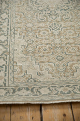 Turkish Sparta rug close-up: worn Herati pattern, banded Samovar border in muted ecru, brown, and teal.