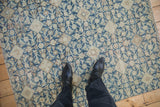 Distressed Hamadan rug with Herati pattern in sky blue, ivory, and noticeable wear.