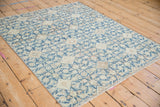 Distressed Hamadan rug close-up: blue and ivory Herati pattern with soft, even wear.