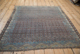 Antique Malayer rug with a distressed all-over Boteh lattice in sapphire blue and dusty terracotta.