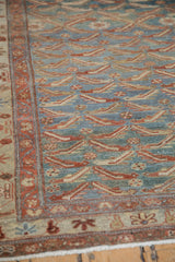 Evenly worn, low pile texture of the traditional fish motif on a Persian Malayer rug.