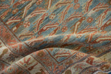 Softly draped vintage Malayer rug showing the hand-knotted texture of its fish design motif.