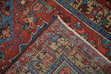 Hand-knotted foundation and pile, with dark selvage and fringe, on a Persian Heriz rug.