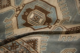 A draped view highlighting the textured weave and finned detailing of a vintage Malayer rug.