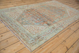 Distressed antique Serbend rug texture with time-softened dusty teal and terracotta abrashes.