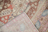 The machine-bound edge and woven foundation of the hand-knotted vintage Caucasian rug.
