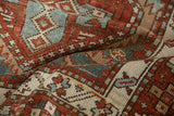 Hand-knotted texture of a vintage Karaja runner with even wear to the pile.
