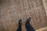 Distressed Mahal rug showing worn texture, visible knot heads, and faded tree of life design.