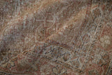 Textured distressed Mahal rug showing worn pile and muted terracotta, beige, and silver tones.