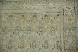 Distressed vintage Senneh rug pile showing worn powder blue and dusty gold boteh patterns.