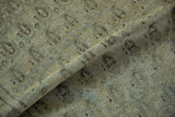 Vintage distressed Senneh rug's folded pile reveals softened boteh motifs in muted tones.