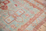 Distressed vintage Malayer rug, powder blue field with raspberry red geometric shapes and serpent motifs.