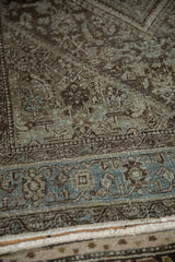Distressed Northwest Persian rug detail, dusty blue border, even wear, faint foundation.